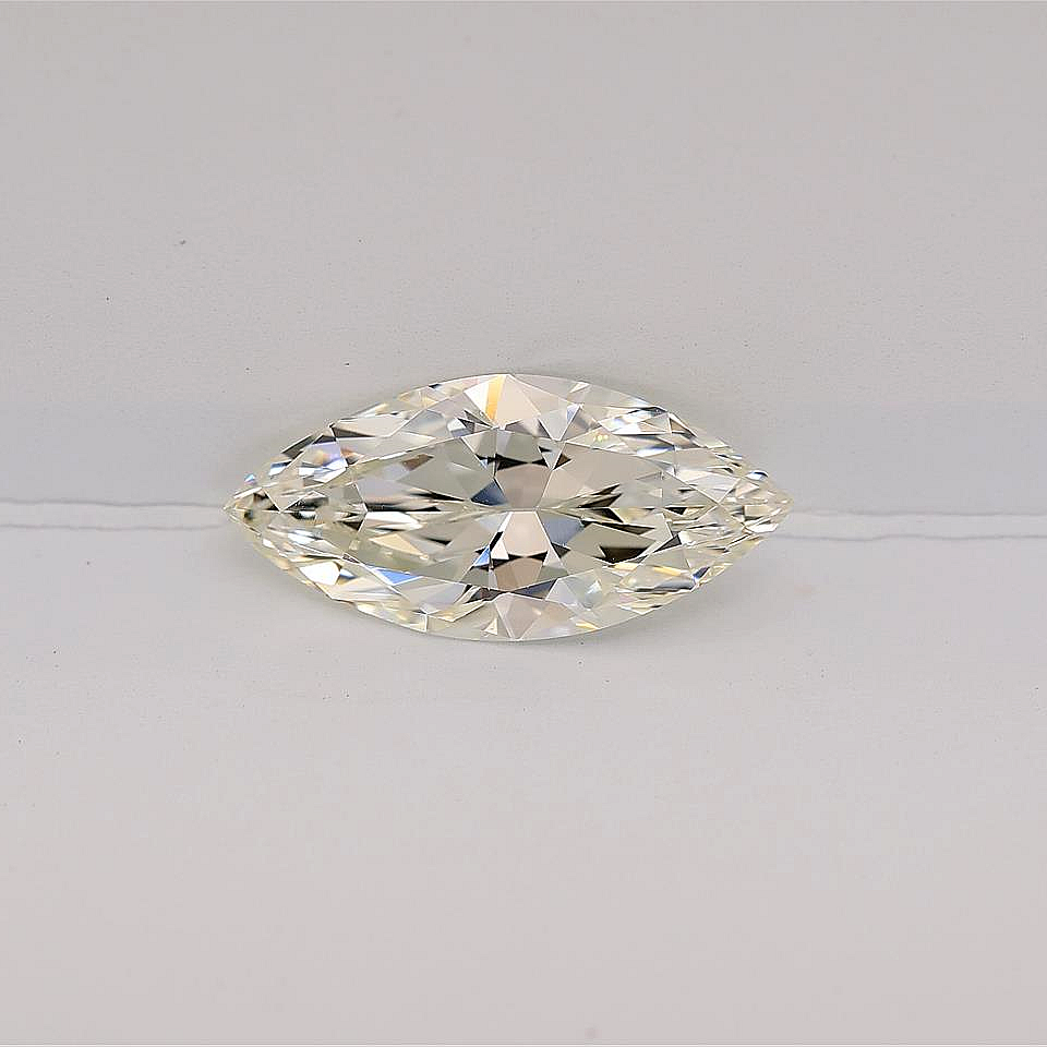 Marquise-shaped diamond on a light gray background