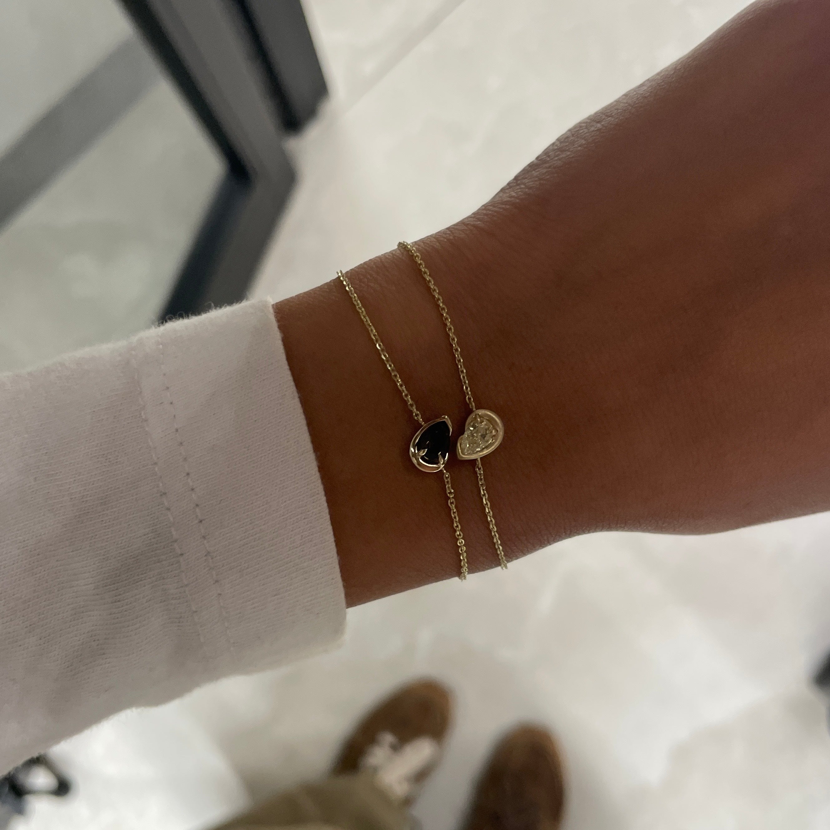 yellow diamond and smokey quartz BB Thelma Bracelets on arm with white sleeve