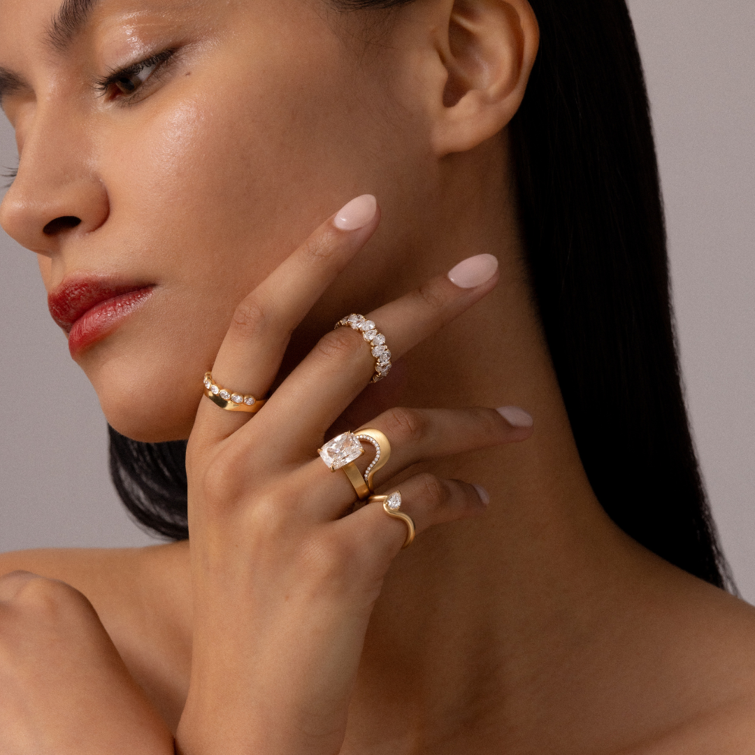 Hand model wearing BB Thelma pinky ring Diamond+ Selene ring+ Zaria band+ BEA PEAR WEDDING BAND+
Diamond Twin Flame band+