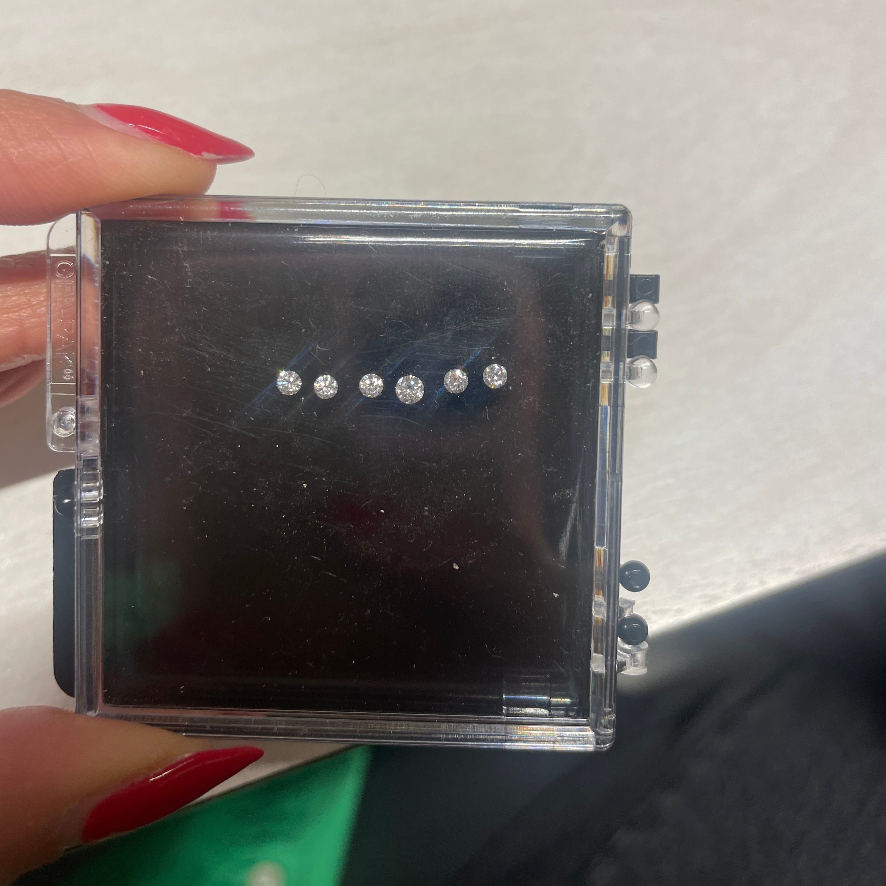 Bezel Set Round Diamond Wedding Band, diamonds on case