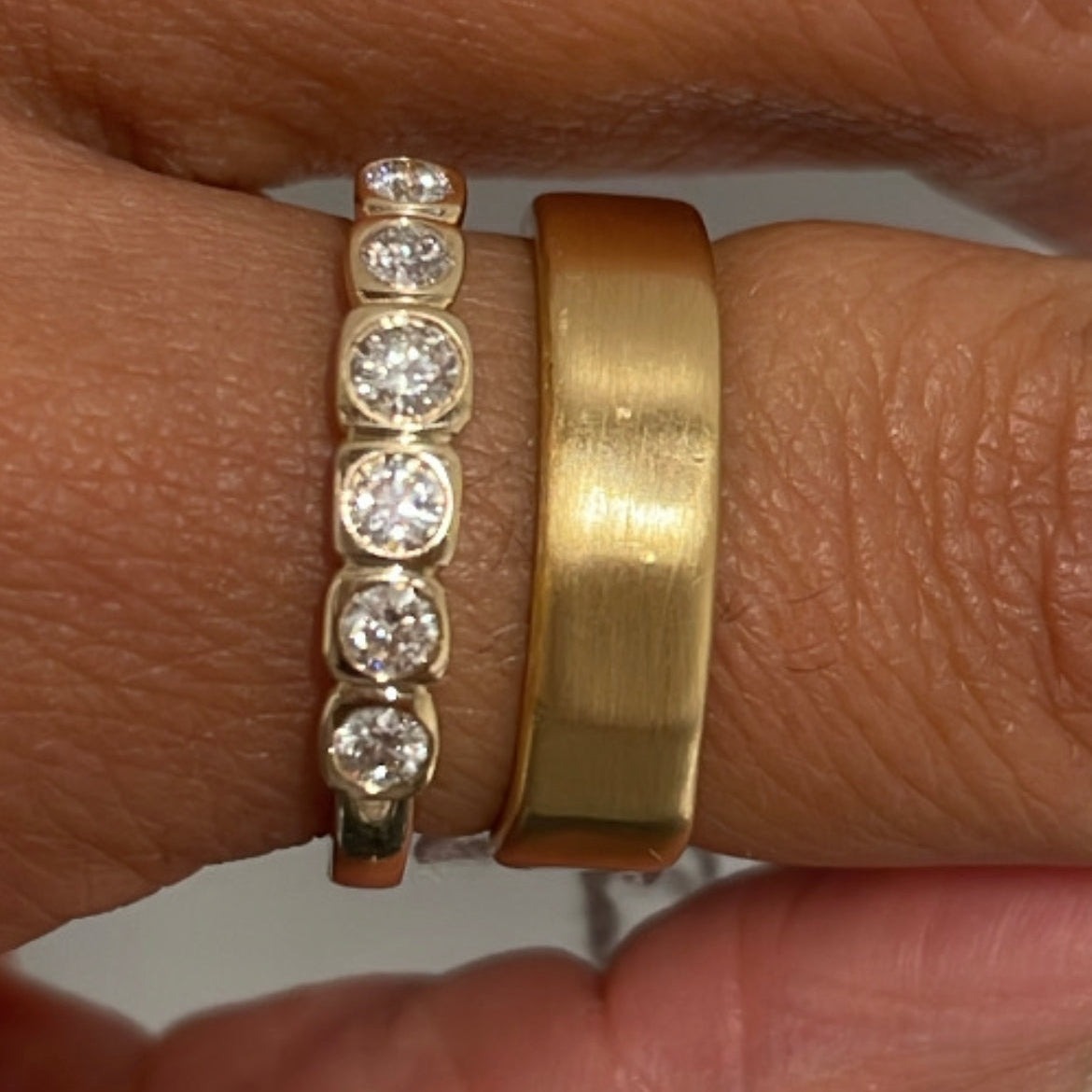 Bezel Set Round Diamond Wedding Band, on finger with thick satin band