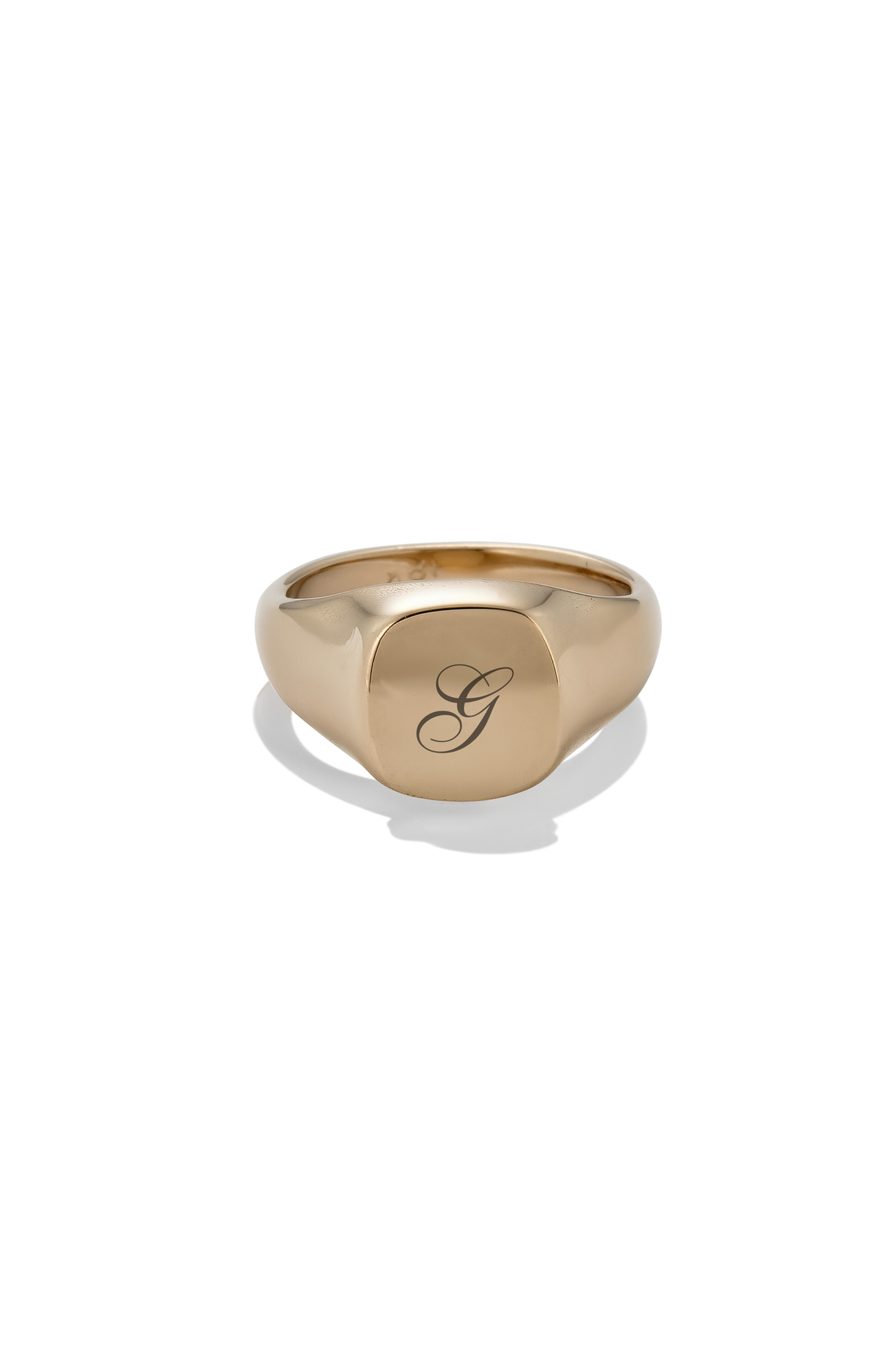 A polished gold signet ring with a raised square face engraved with a cursive letter 'G', shown on a clean white background with a soft shadow.