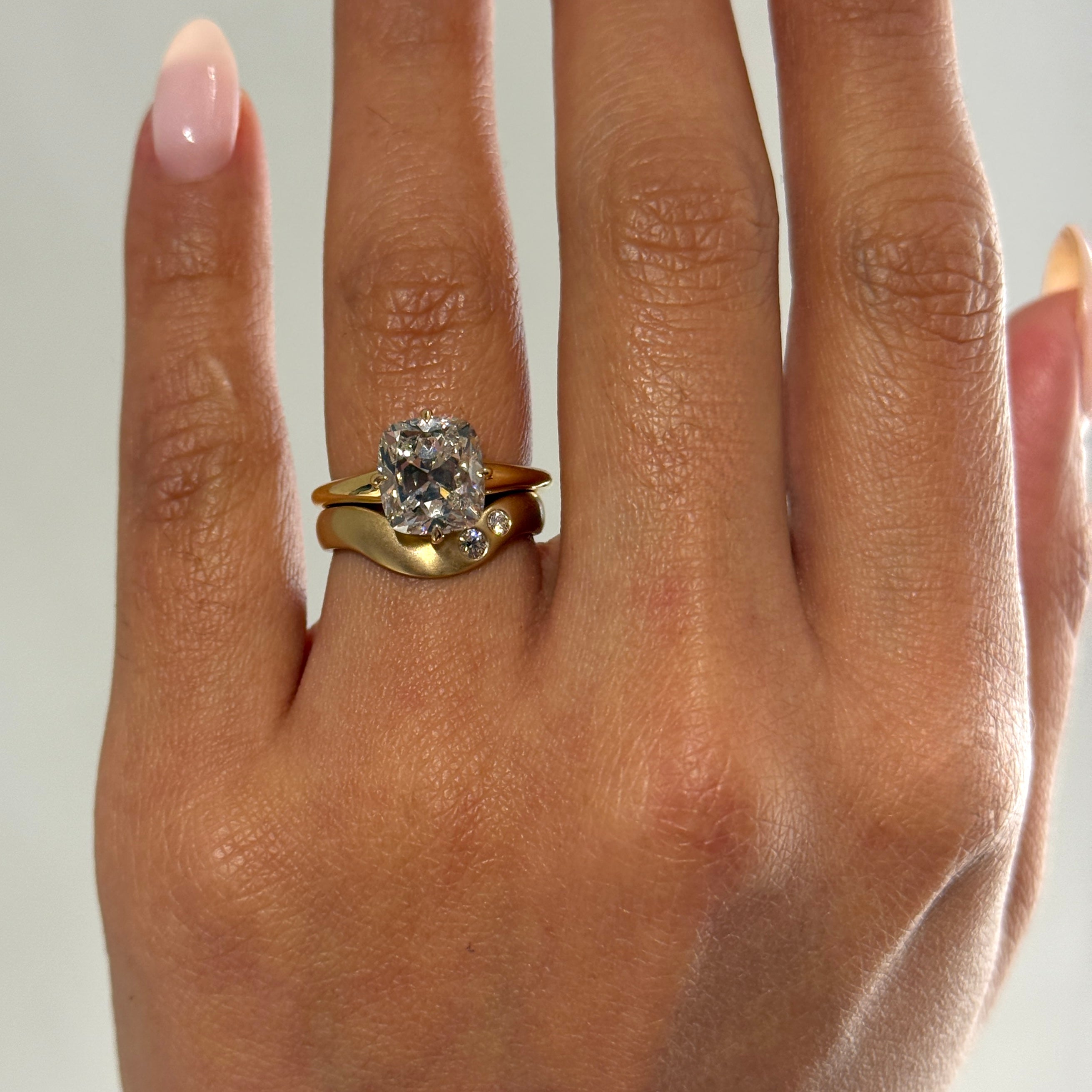 Karolina wave wedding band with diamond accents