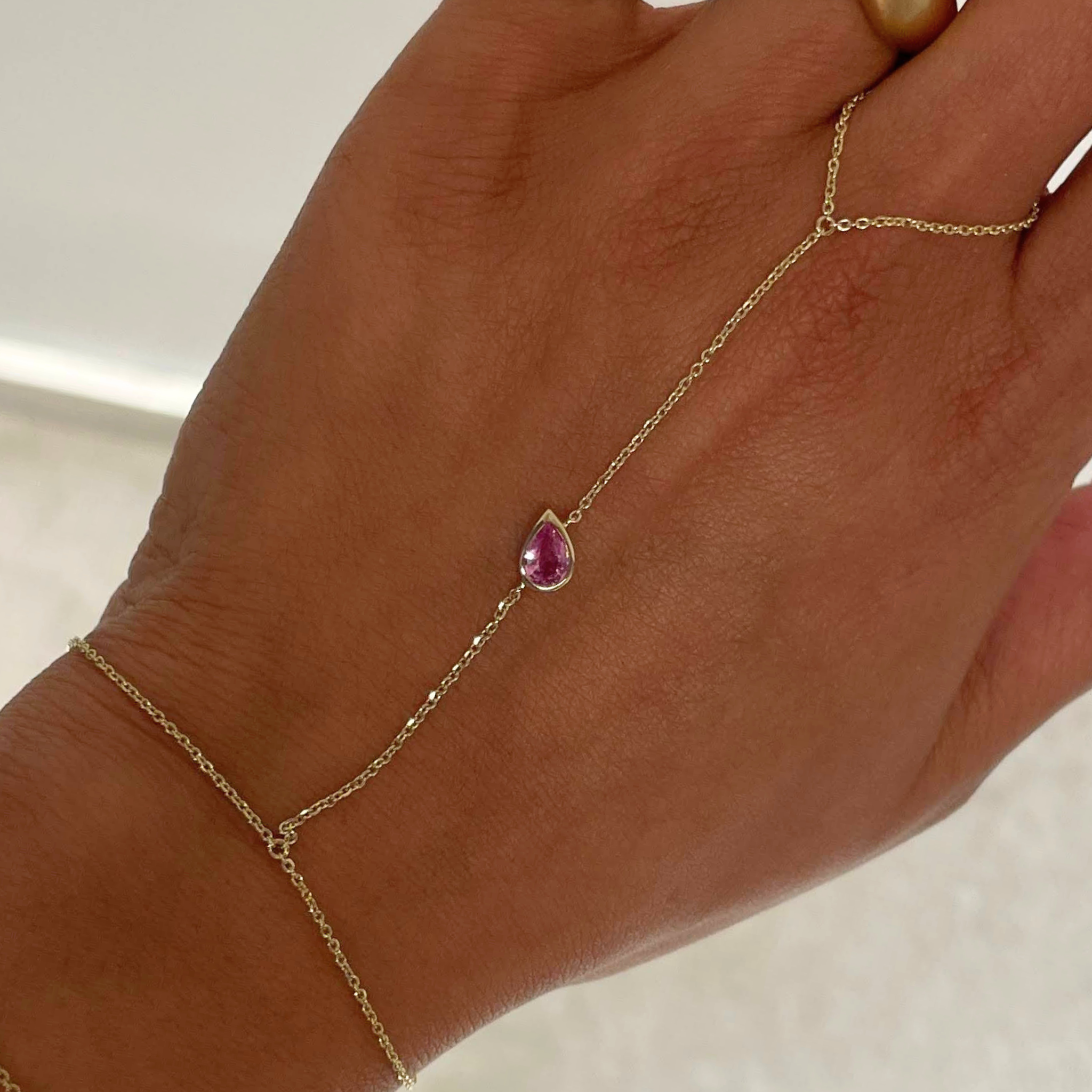 close up of pink hand chain