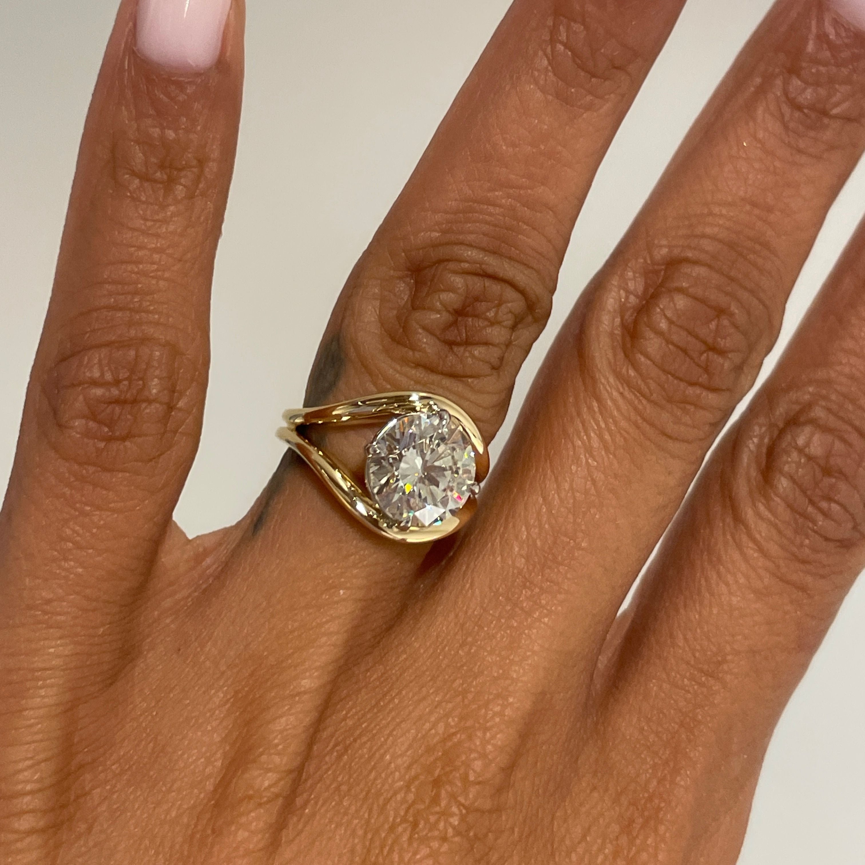 Round Diamond in a Split Shank Band, on finger