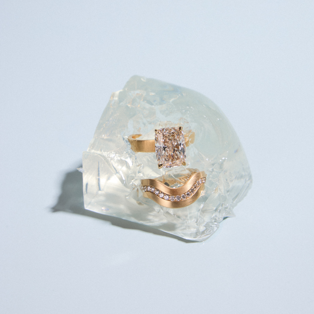 desert diamond engagement ring with curved diamond wedding band in ice cube