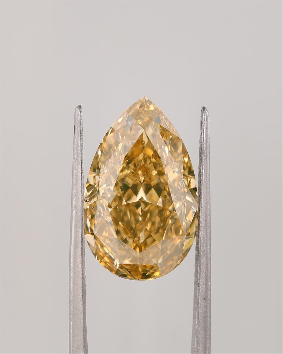 10.13 CRT FDBOY SI2 PEAR CUT DIAMOND held by tweezers