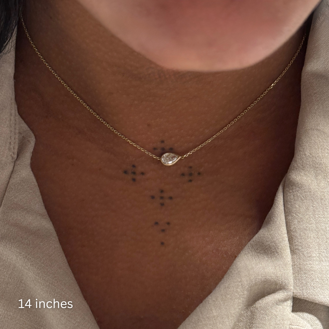 woman wearing white diamond max mini necklace clasped at 14 inches