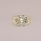 Oval-shaped diamond on a light gray background