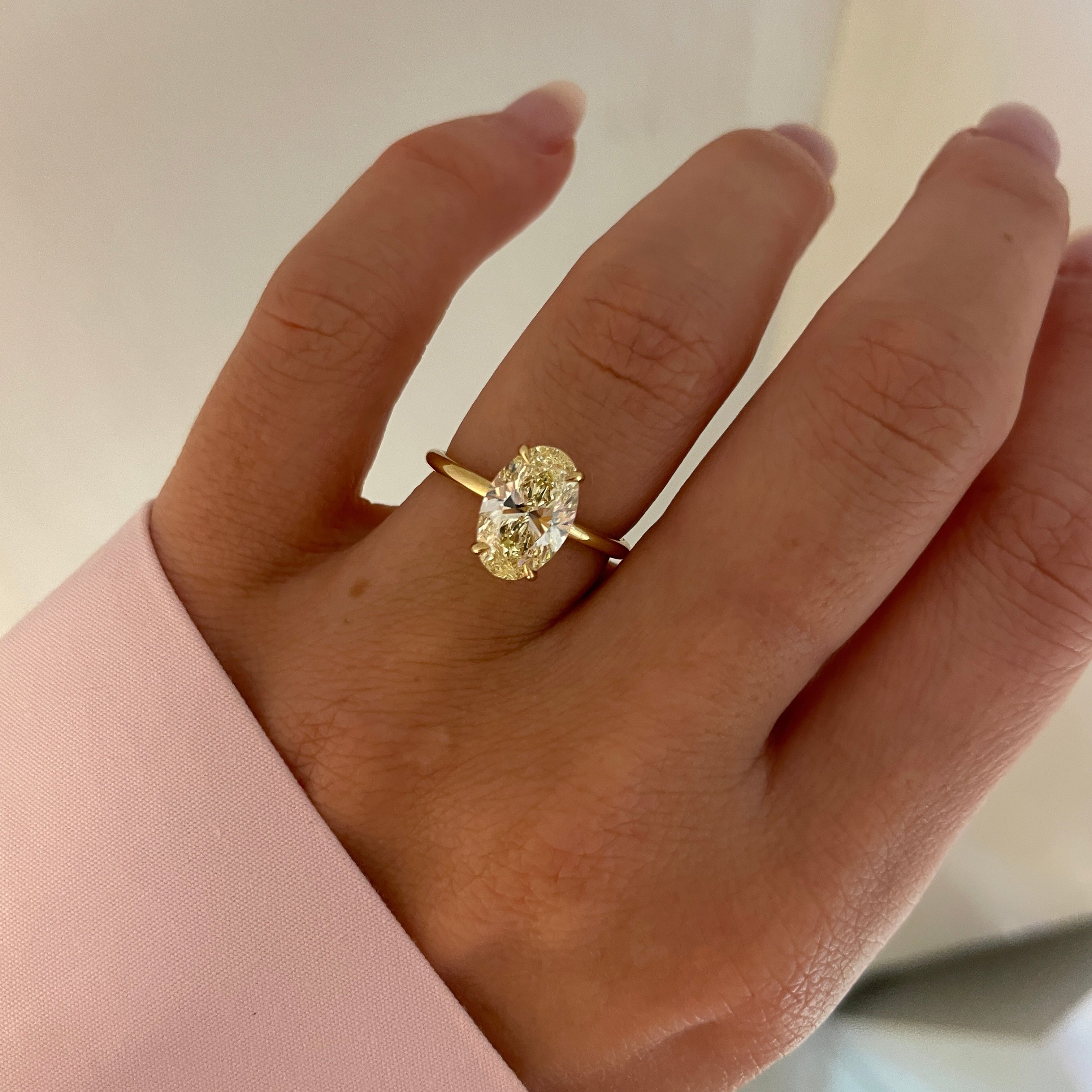ALINA 2.51 18kt Yellow Gold Engagement ring on models finger against a neutral background