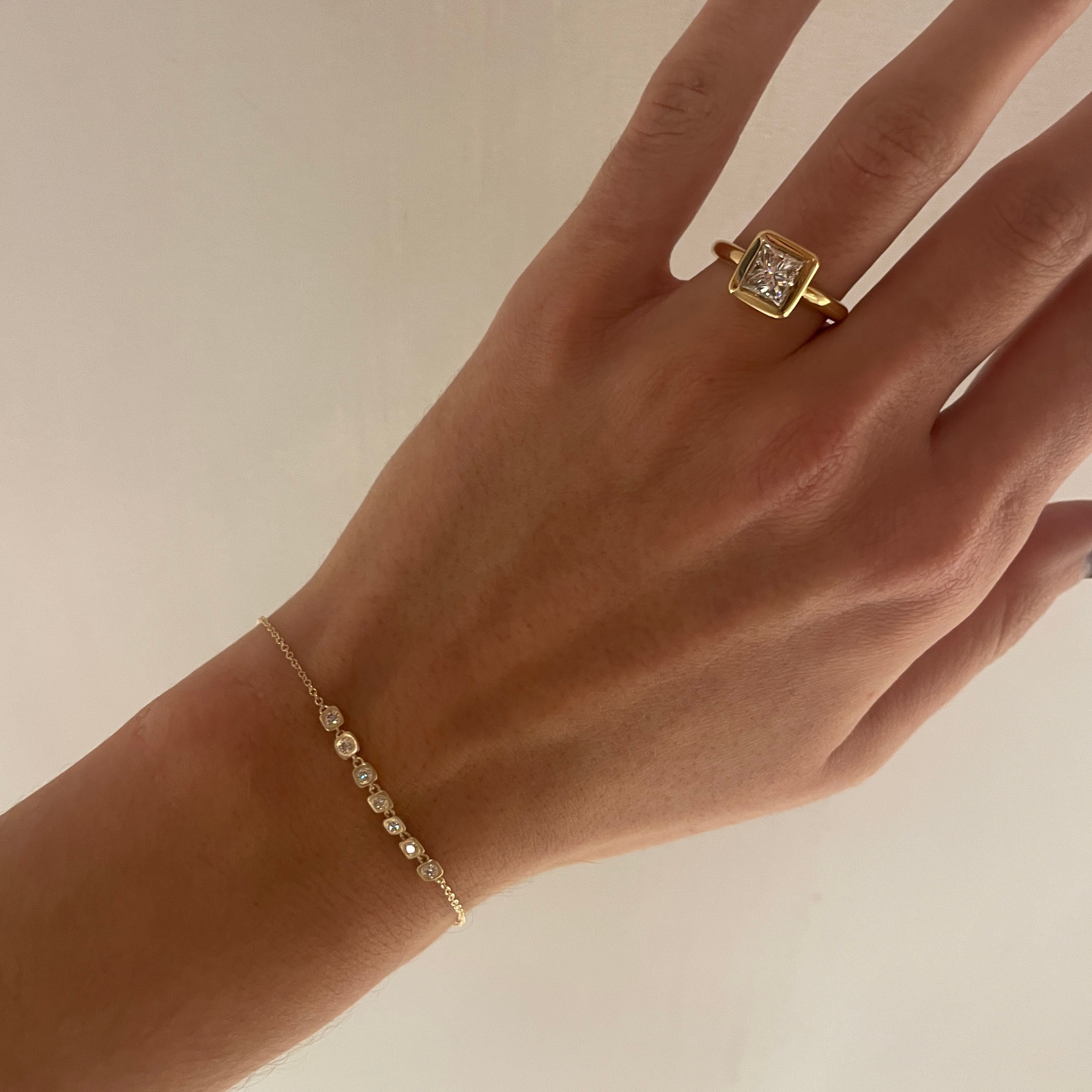 Bubble Bezel bracelet on wrist with MARGAUX 1.60 RING on finger. 