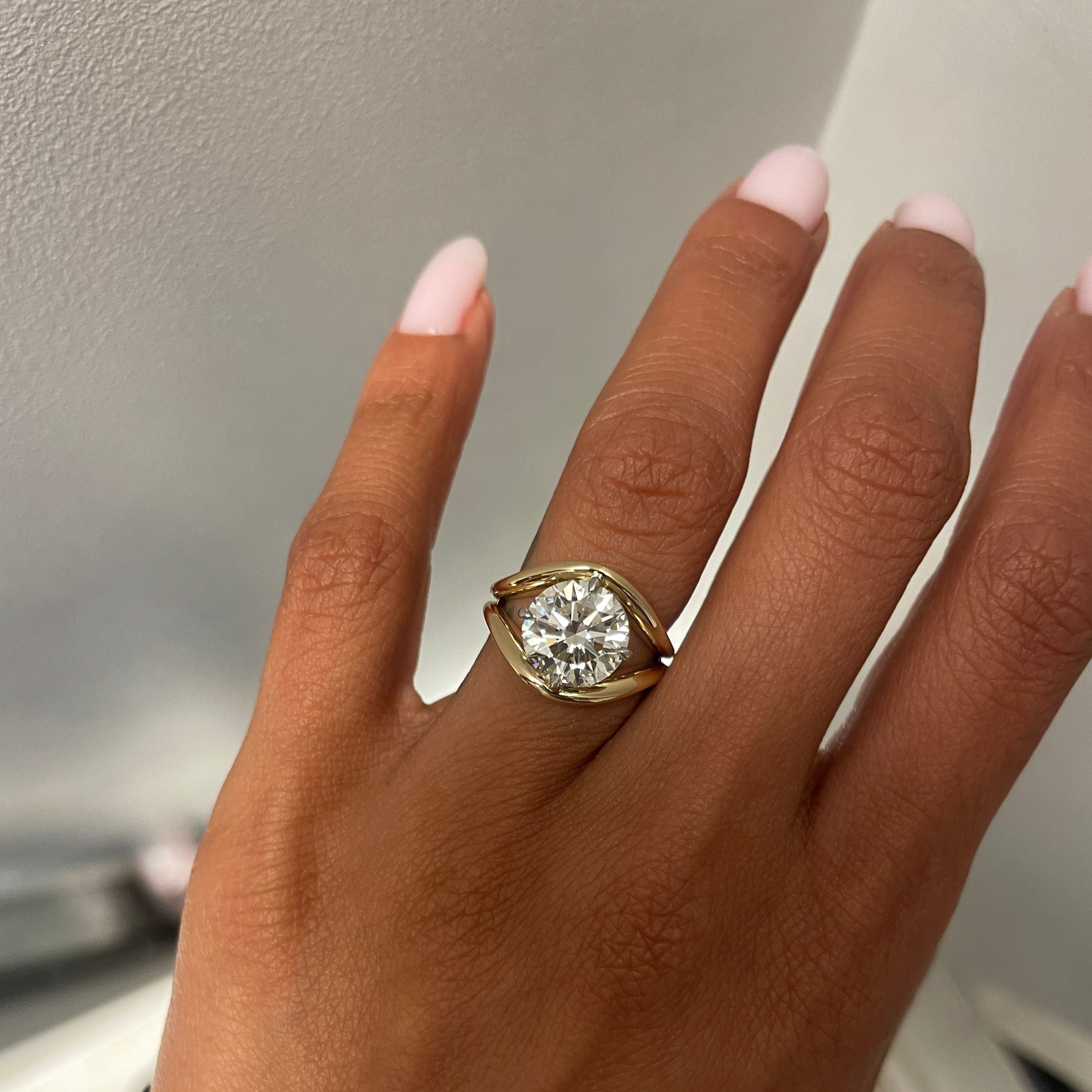 Round Diamond in a Split Shank Band, on finger, 2nd view