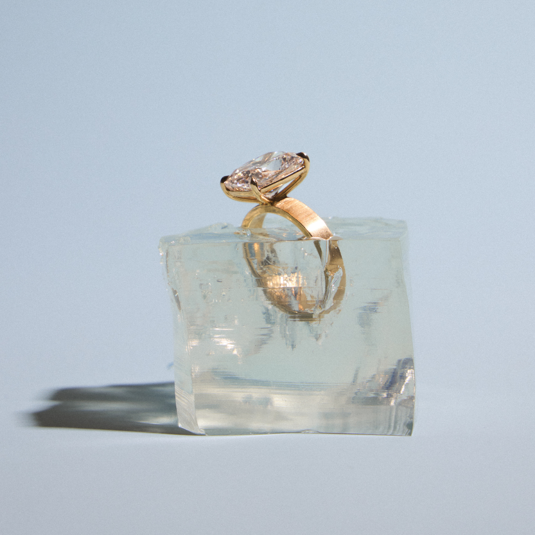 gold satin finish ring in ice cube