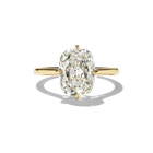 Gold ring with a large diamond on a white background
