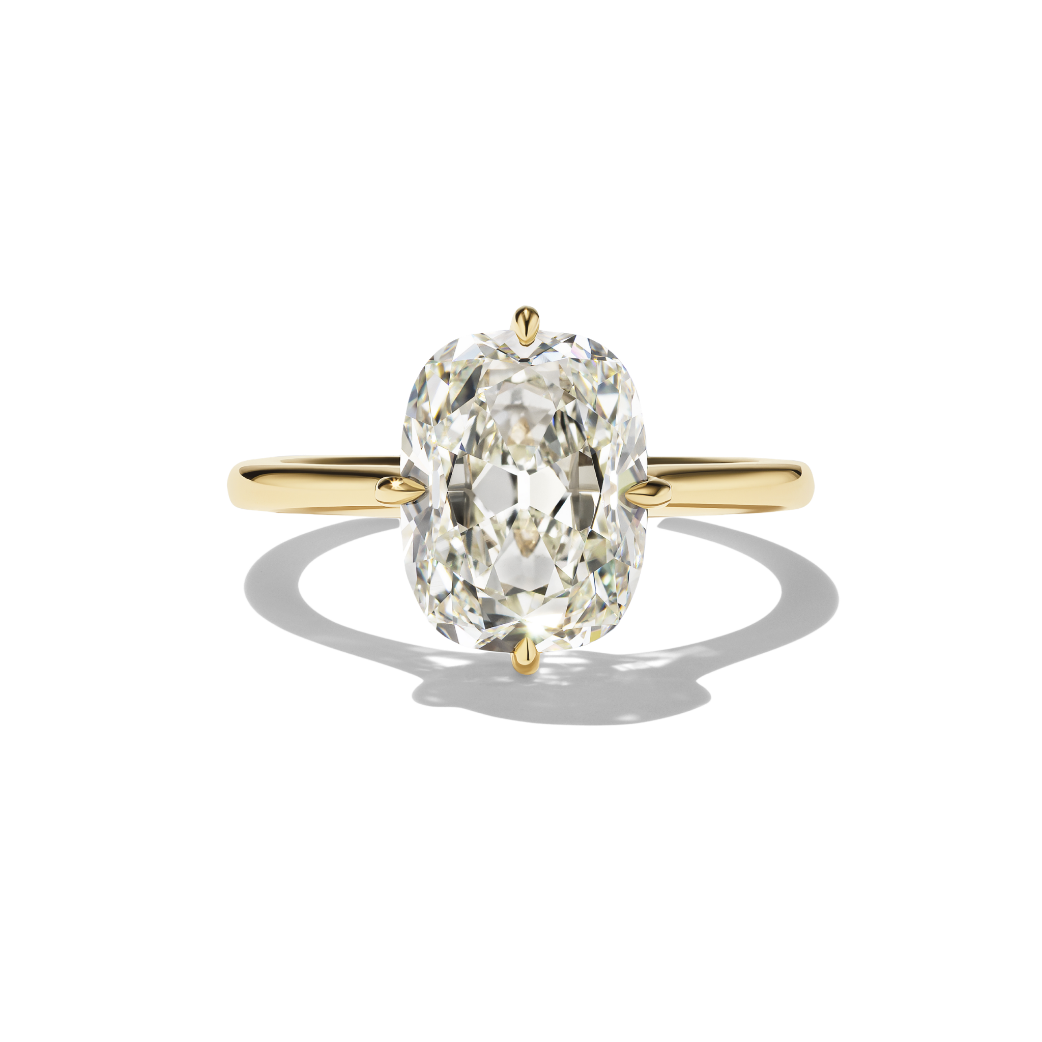Gold ring with a large diamond on a white background