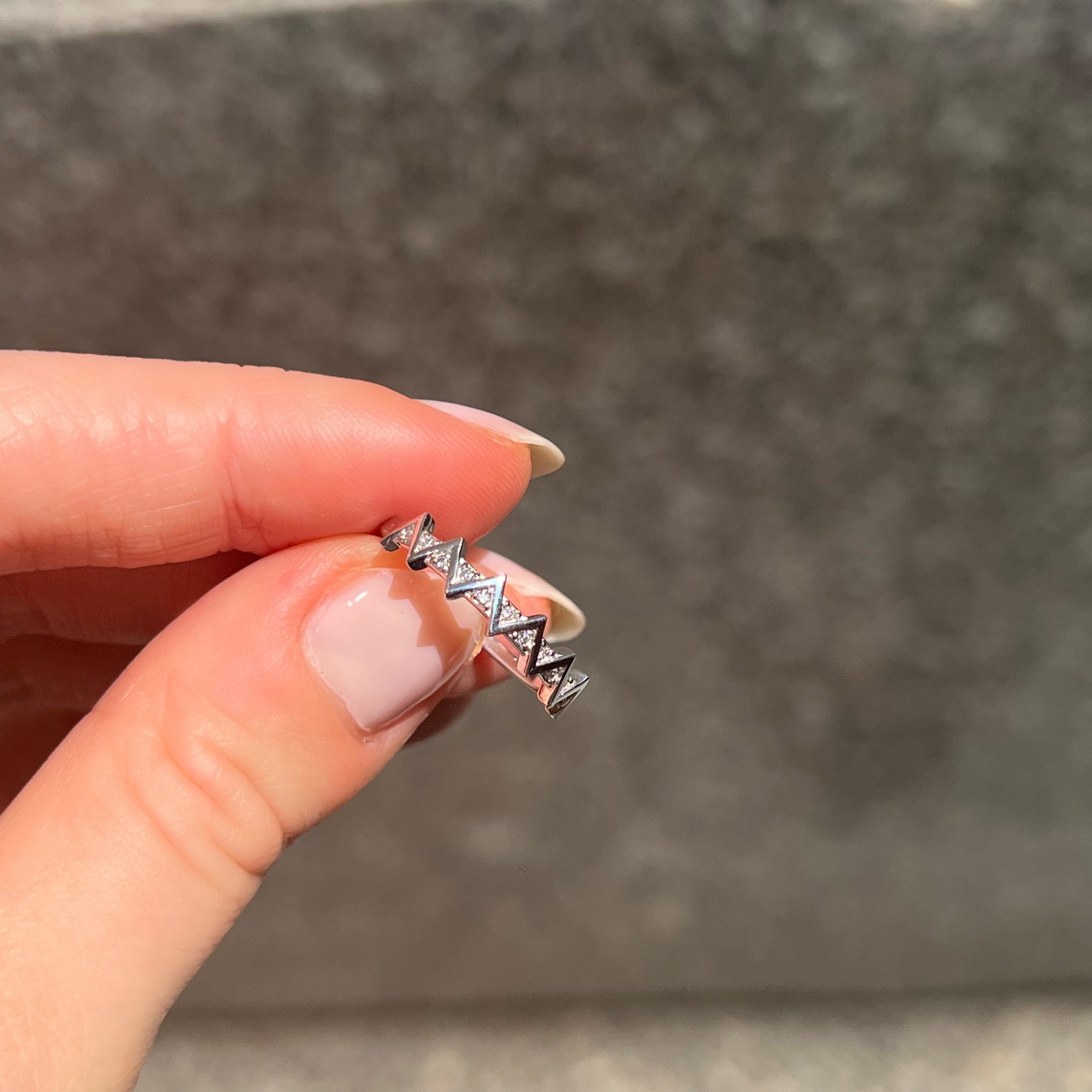 ZIG ZAG 14KT WHITE GOLD DIAMOND RING, in hand