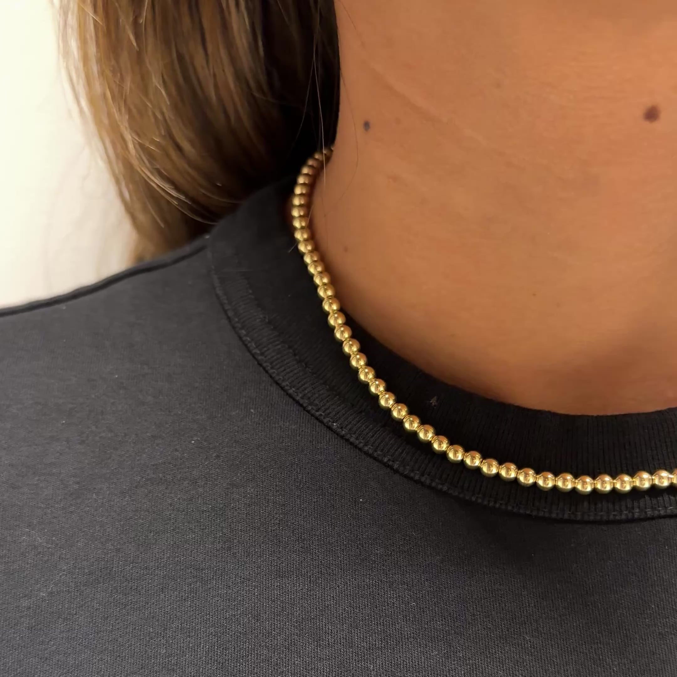 4MM Ball Chain worn on neck of model wearing a black shirt.