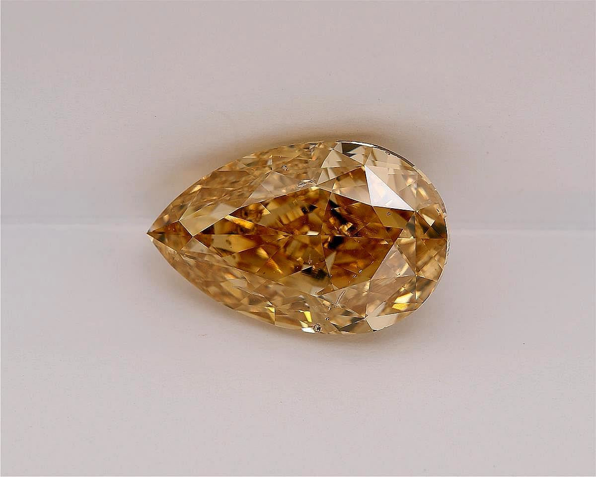 10.13 CRT FDBOY SI2 PEAR CUT DIAMOND on a grey background, slowly rotating.  