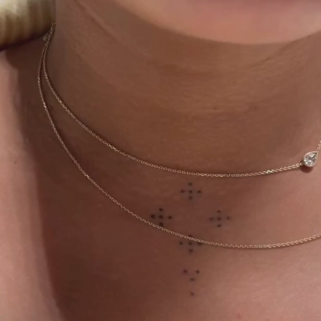 max and max mini necklaces on woman's neck